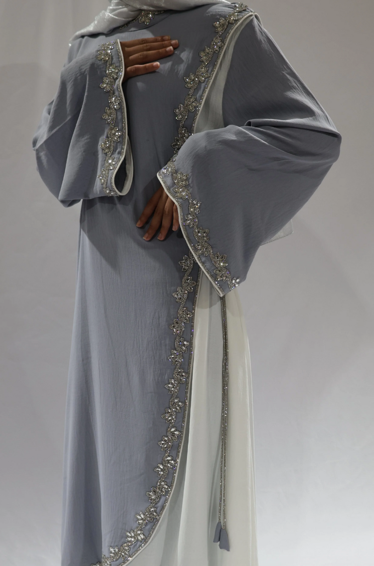 Grey open abaya with embellished floral trim over a white inner dress